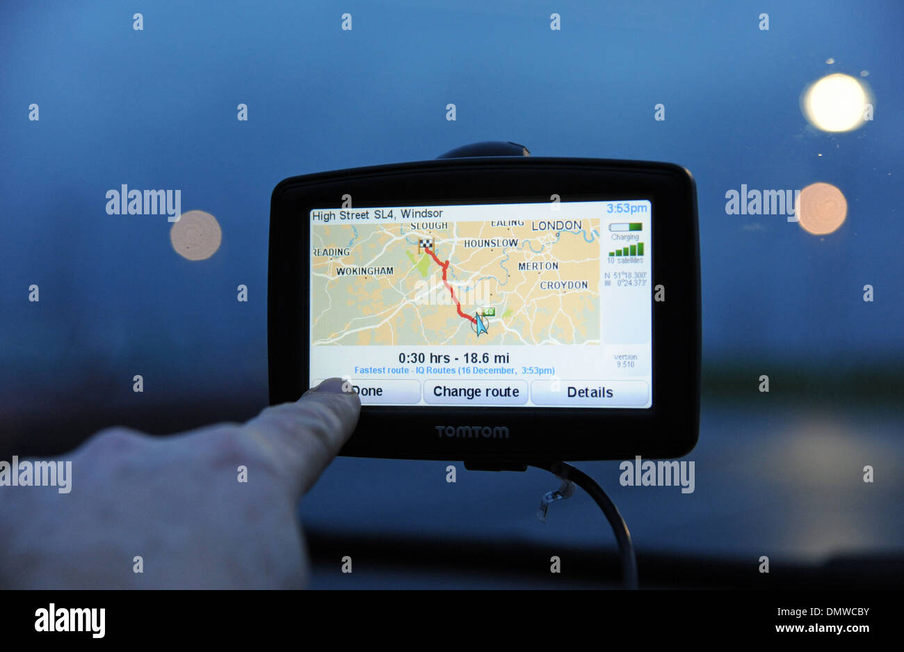 TomTom Sat nav being used in a car for navigation Stock Photo