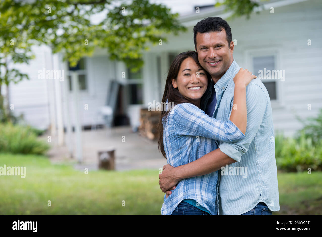 A couple  with arms around each or. Stock Photo