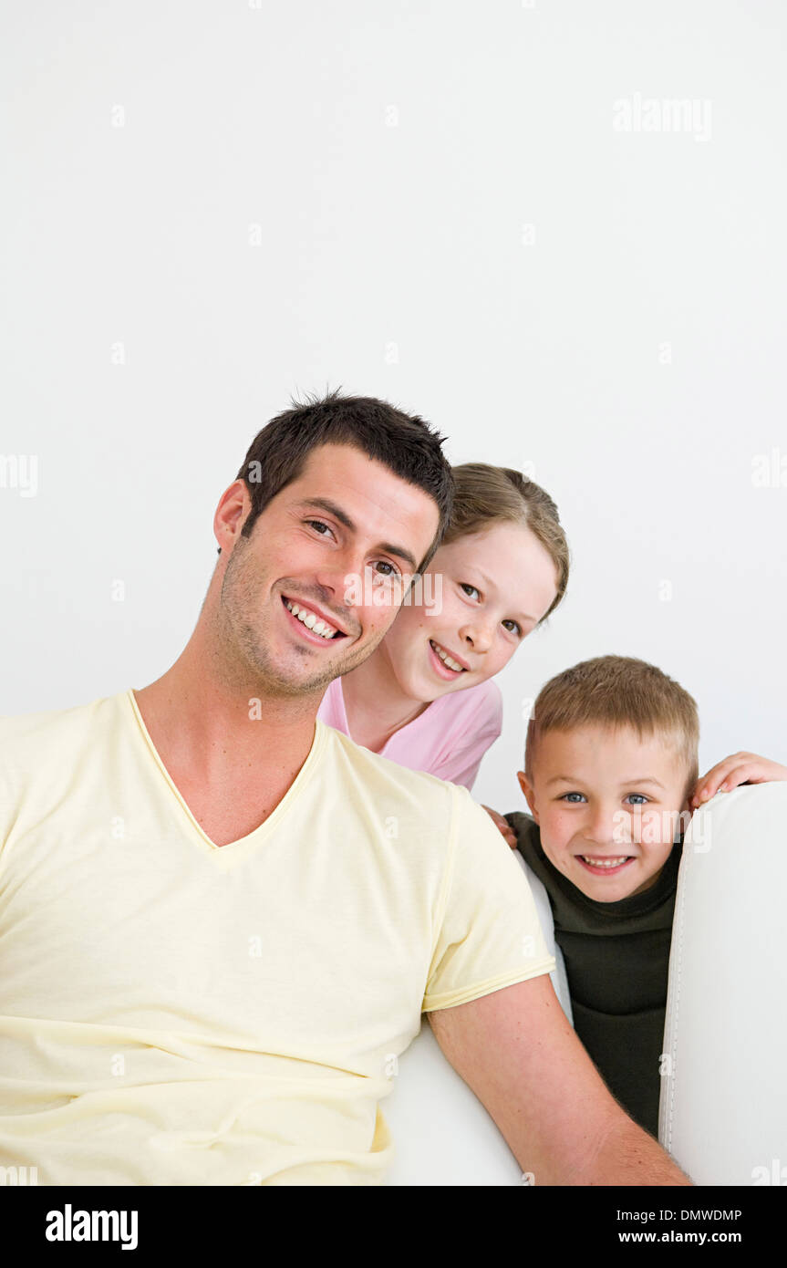 A man and two children at home a boy and a girl. Stock Photo