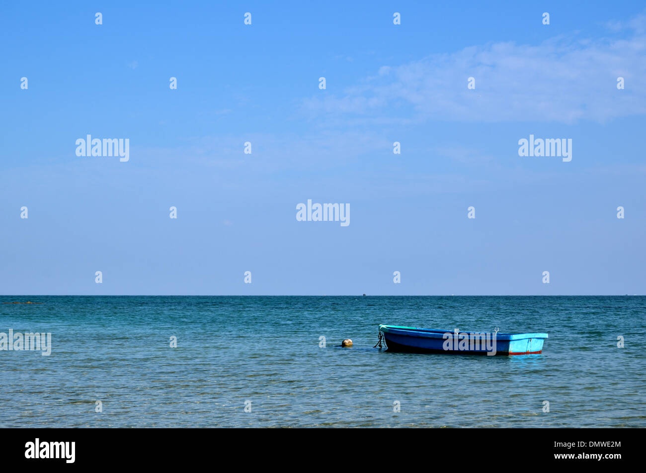 Blue boat at the western coast of the japanese island Okinawa Stock Photo