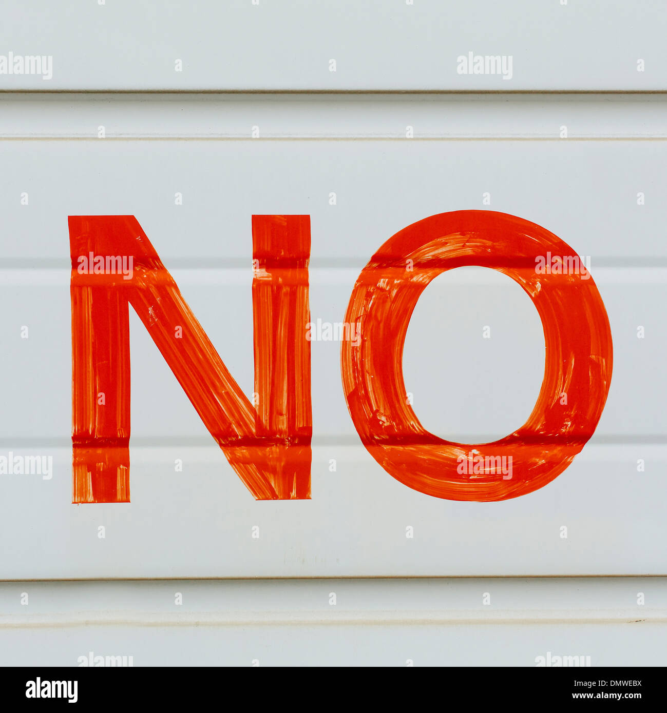 A Large No Sign In Red Paint On A Garage Door Indicating No
