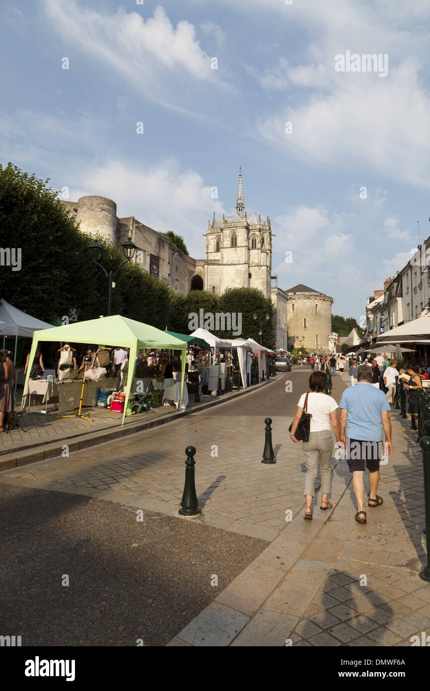 Amboise summer evening market, couple strolling hand in hand up street ...