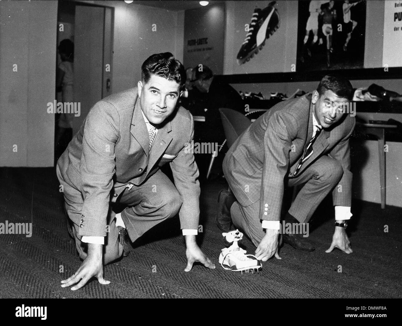 April 17, 1962 - Munich, Germany - German sprintersHEINZ FUTTERER and ARMIN HARY, are the new spokesmen for the 'Puma,' sportswear line, here they are modelling some track spikes. (Credit Image: © KEYSTONE Pictures USA/ZUMAPRESS.com) Stock Photo