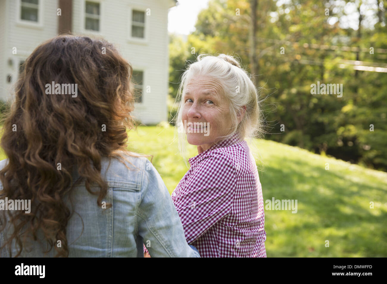 A family summer garing at a farm. A shared meal a homecoming. Stock Photo