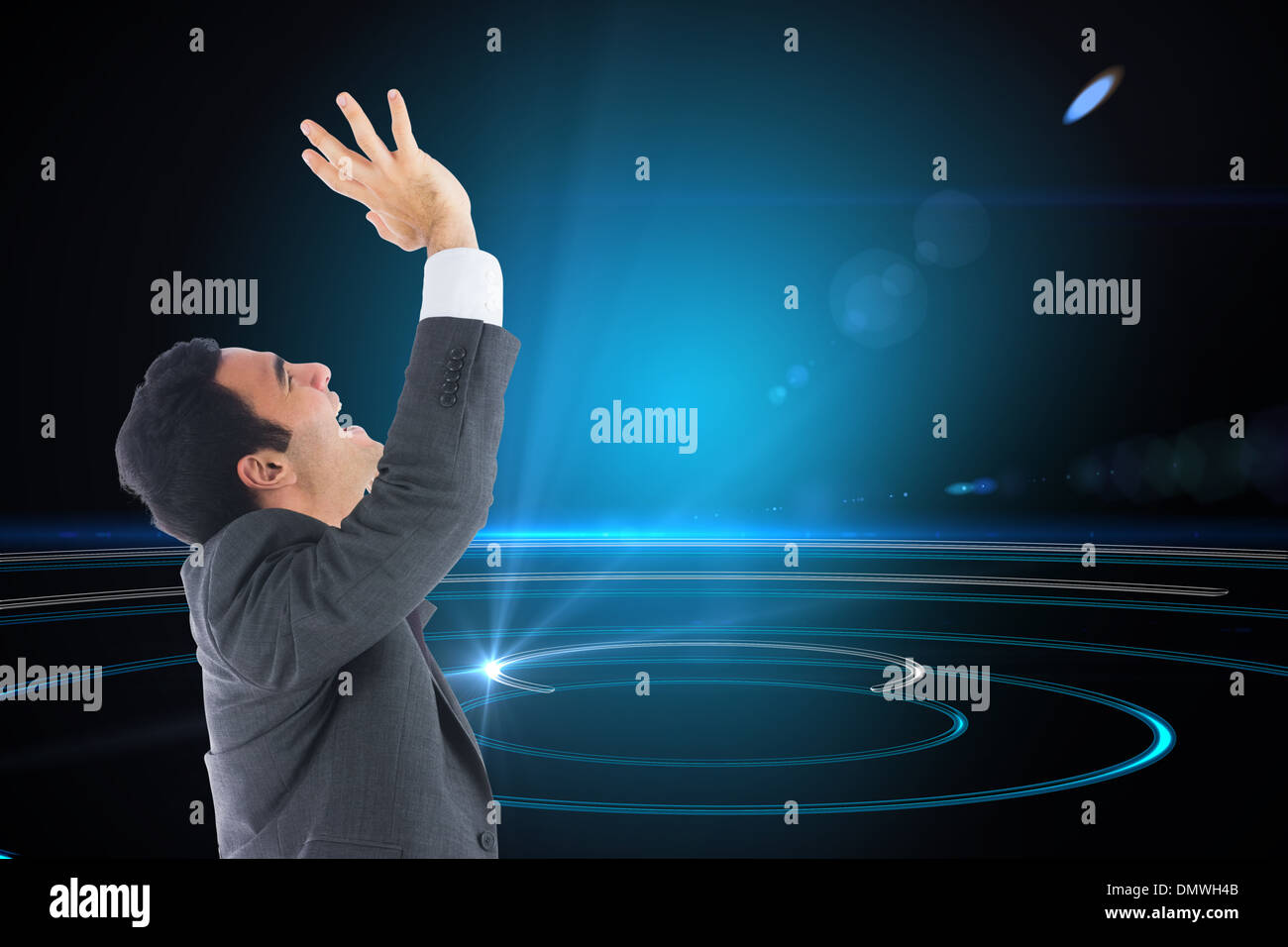 Composite image of excited businessman with arms raised Stock Photo - Alamy
