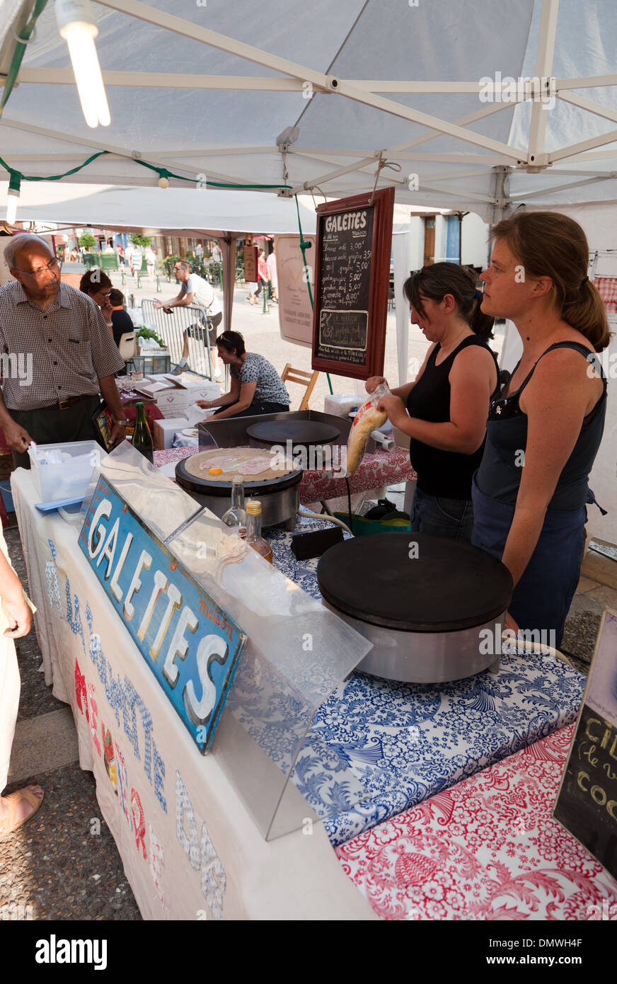 Amboise summer evening market two stall holders selling galettes Stock ...