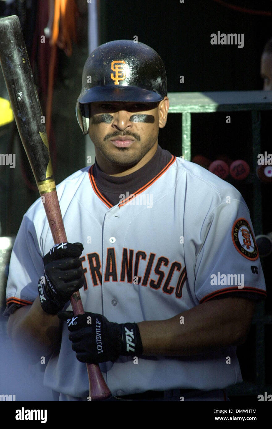 Nov 11, 2001; San Francisco, CA, USA; St. Louis Cardinals first baseman Mark  McGwire pulls off his batting gloves after striking out in the eighth  inning during game against the San Francisco