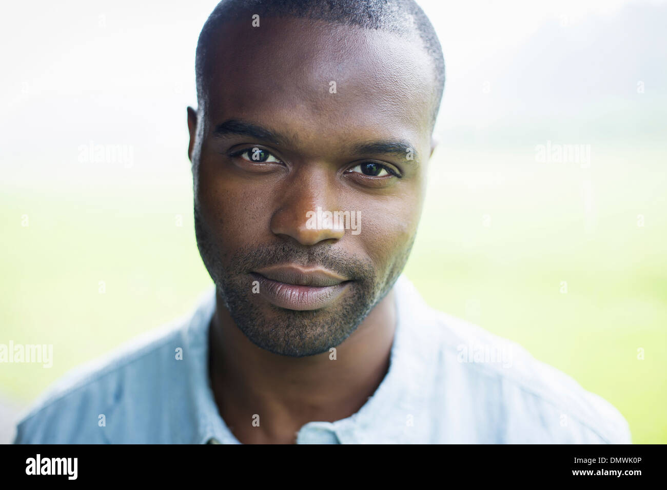 A young man in a blue shirt. Stock Photo