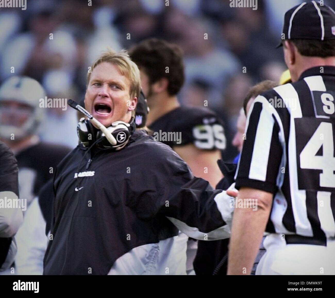 Dec 06, 2001; Oakland, CA, USA; Raider head coach Jon Gruden screams his displeasure at side judge Tom Fincken after an apparent fumble recovery for a touchdown was called back during the 3rd quarter of their Jan. 6, 2000 game against Miami in Oakland, Calif. Stock Photo