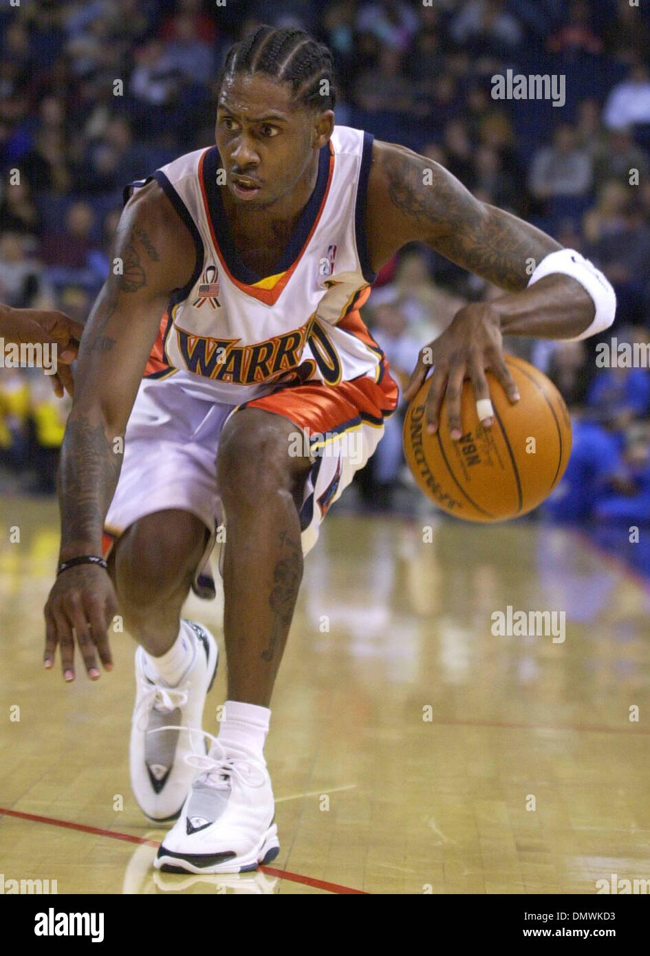 Jan 14, 2002; Oakland, CA, USA; Oakland Warriors Larry Hughes, #20, moves  the ball up court