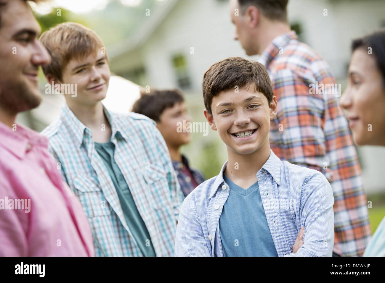 group of people adults and teenagers summer party. Stock Photo
