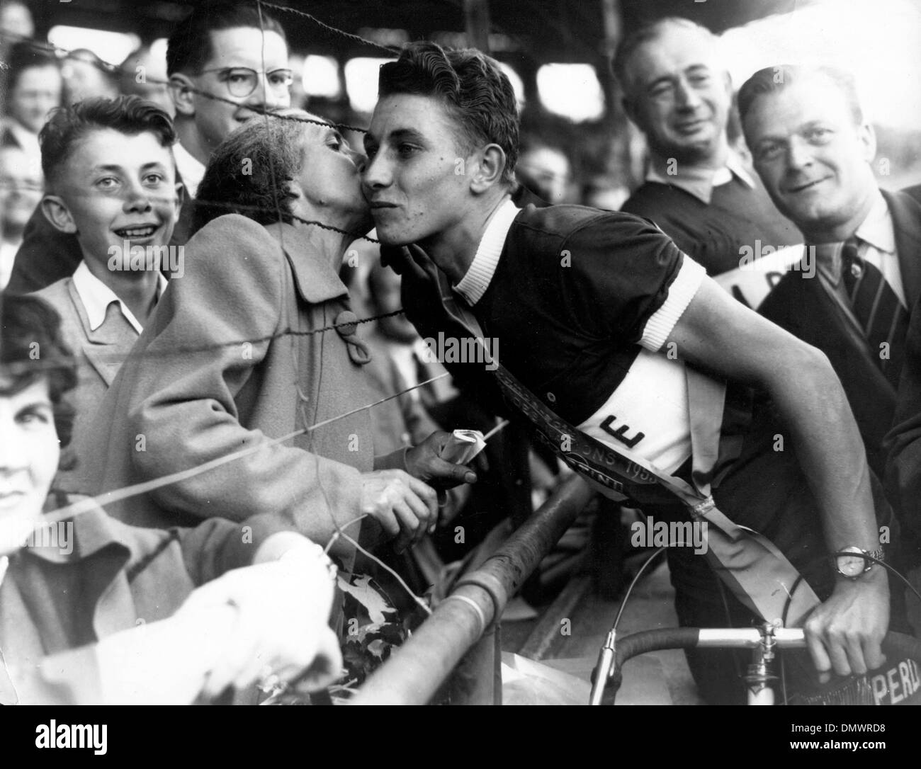 Oct. 27, 1953 - Paris, France - Nineteen year old JACQUES ANQUETIL of Normandy, being kissed by his mother after his victory in the Grand Prix Des Nations, cycle race over a distance of 140kms.  (Credit Image: © KEYSTONE Pictures USA/ZUMAPRESS.com) Stock Photo