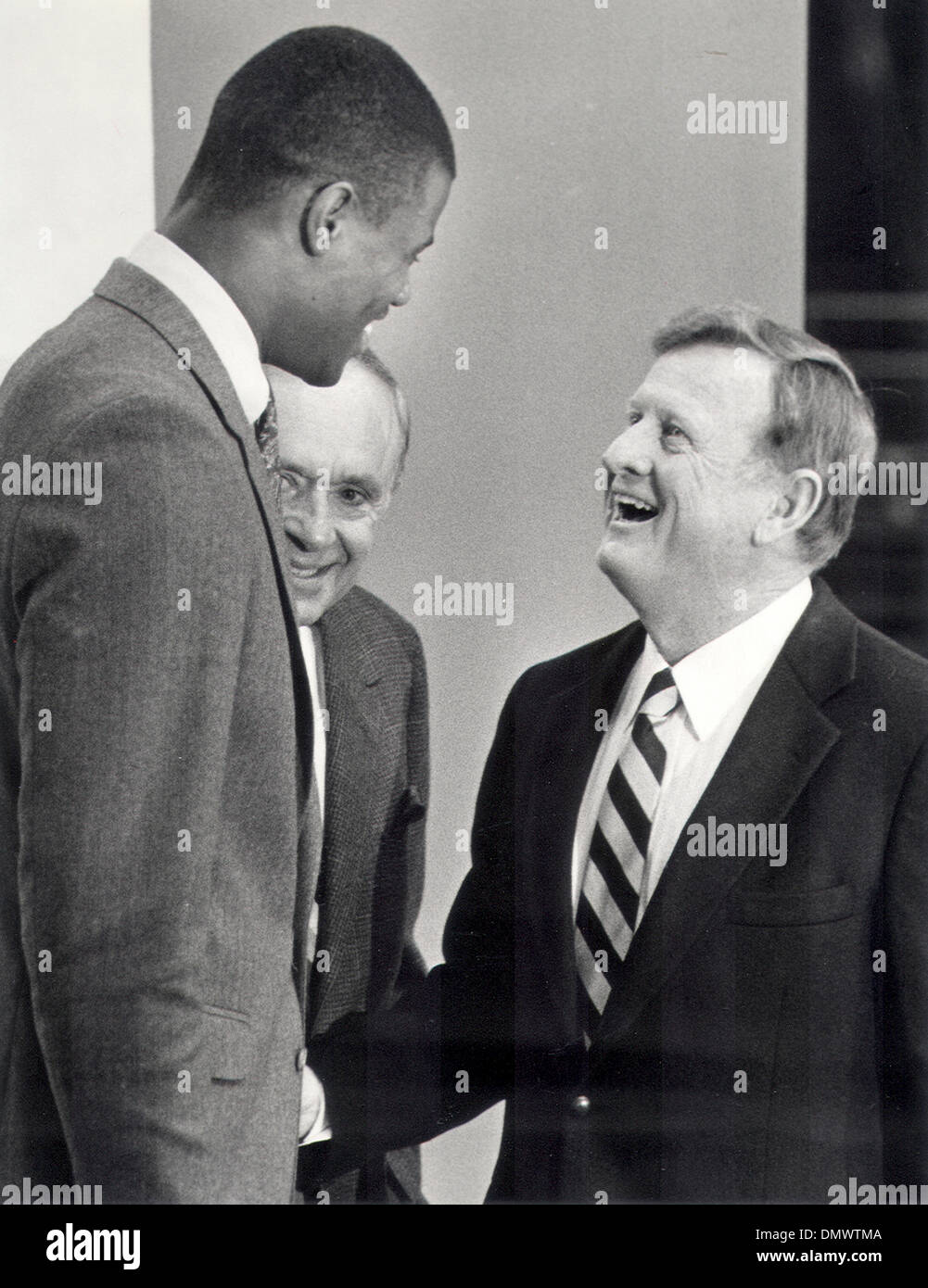 Jan 01, 1987 - San Antonio, Texas, U.S. - RED MCCOMBS (right) shaking hands with first-round draft pick DAVID ROBINSON after Robinson announced he would play with the Spurs. The photo was taken in 1987.  (Credit Image: © Jim Blaylock/San Antonio Express-News/ZUMApress.com) Stock Photo