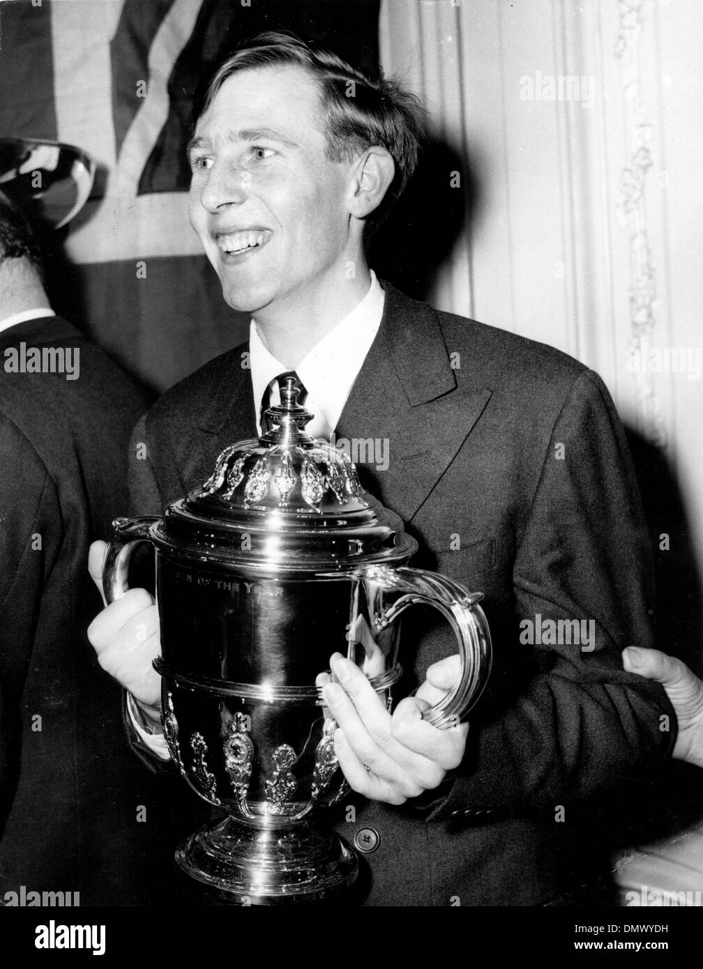 Dec. 30, 1954 - London, England, U.K. - Britain's premier athletes received their awards at the Savoy Hotel this evening. Pat Smythe received the 'Sportswoman of the Year' trophy and Chris Chataway the Television 'Sportsview' award. The picture shows Dr. ROGER BANNISTER in a happy mood with his trophy after the ceremony at the Savoy Hotel this evening. (Credit Image: © KEYSTONE Pic Stock Photo