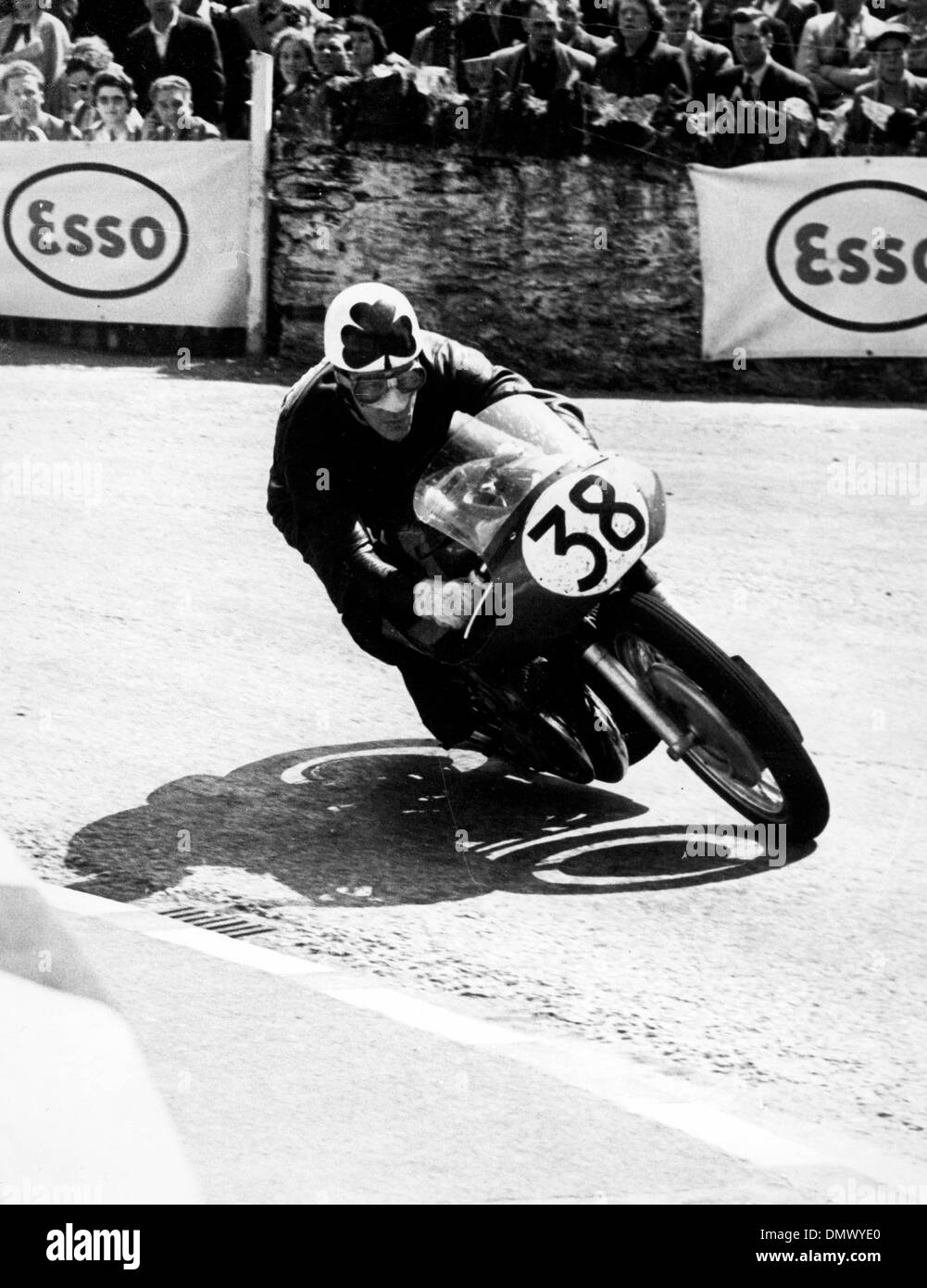 June 13, 1955 - Isle of Man, U.K. - REG ARMSTRONG of Dublin, at speed at Quarter Bridge, when he took second place in the Senior T.T. on the Isle of Man. His speed was 96.74 m.p.h., on a Gilera. The even was won by Geoff Duke at the record speed of 97.93 m.p.h.. PICTURED: Armstrong during the race.  (Credit Image: © KEYSTONE Pictures USA/ZUMAPRESS.com) Stock Photo