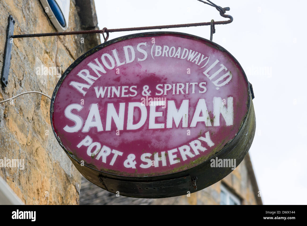 An old wine merchant shop sign in Broadway in the Cotswolds UK Stock Photo