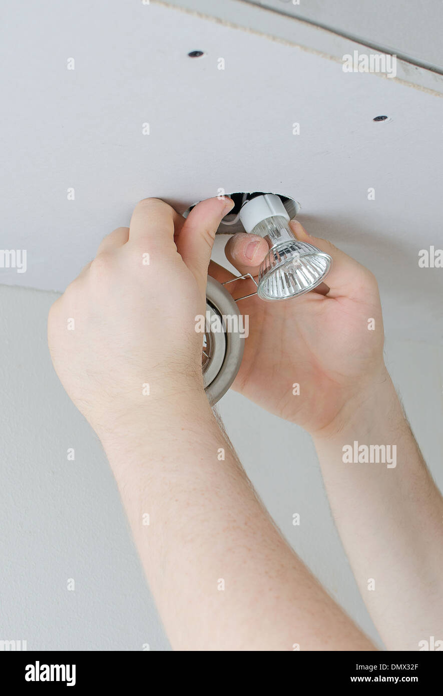 Male hands installing light bulb Stock Photo Alamy