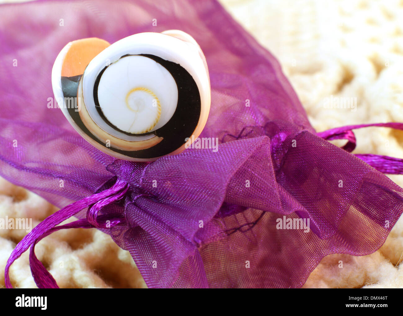 Original handmade ring of sea shell on the knitted background Stock ...