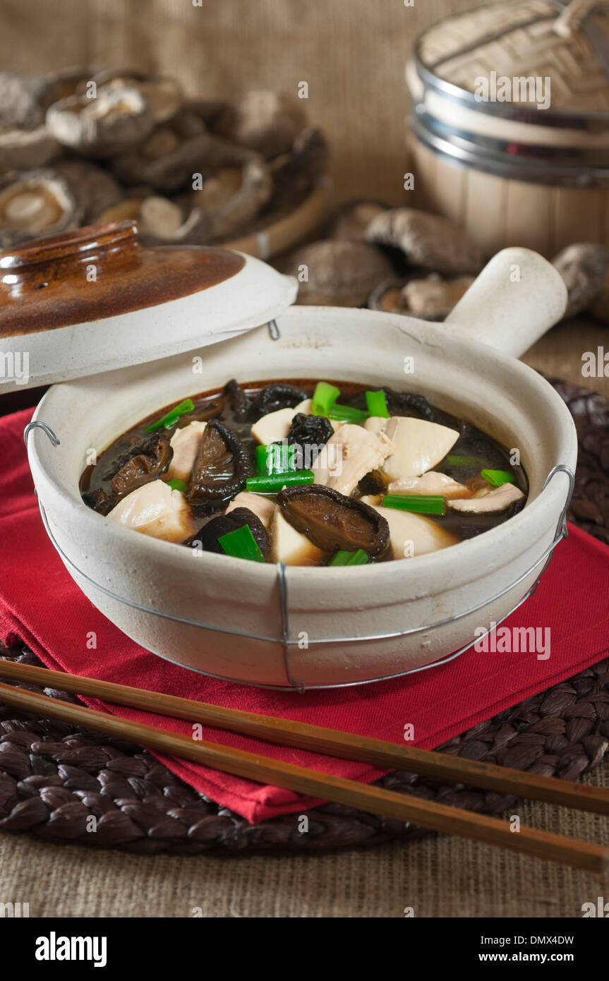 Clay pot chicken with mushrooms. Chinese food Stock Photo