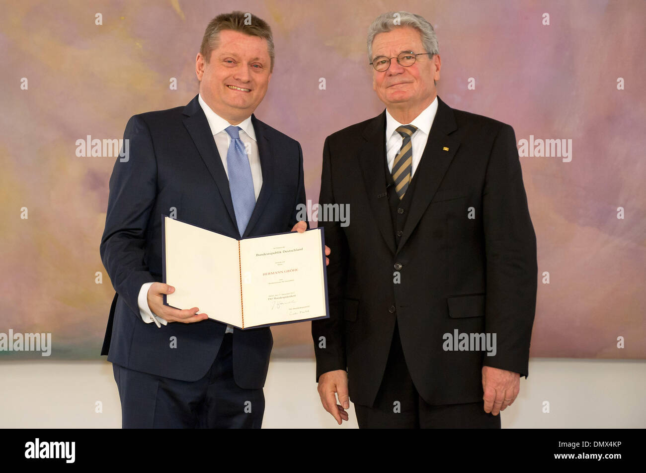 Berlin, Germany. 17th Dec, 2013. German President Joachim Gauck (R) gives the appointment document to the new German Health Minister Hermann Groehe (CDU) in Bellevue Palace in Berlin, Germany, 17 December 2013. Photo: Tim Brakemeier/dpa/Alamy Live News Stock Photo
