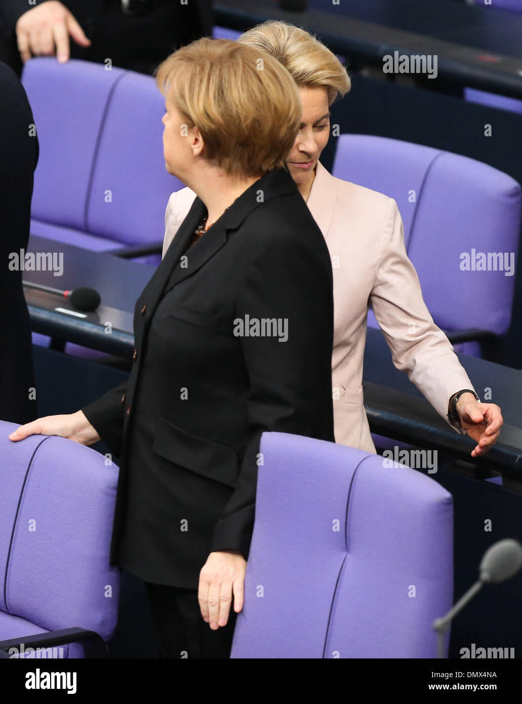 (131217) -- BERLIN, Dec. 17, 2013 (Xinhua) -- German Chancellor Angela Merkel (front) and German Minister of Defence Ursula von der Leyen attend the meeting of Bundestag, Germany's lower house of parliament, in Berlin, Germany on Dec. 17, 2013. German new government headed by Chancellor Angela Merkel was sworn into office on Tuesday to rule Europe's biggest economy for the next four years. Cabinet ministers of the new coalition government, are formed by Merkel's Christian Democratic Union (CDU), its Bavarian sister party Chrisitian Social Union (CSU), and the Social Democrats (SPD). (Xinhua/Z Stock Photo