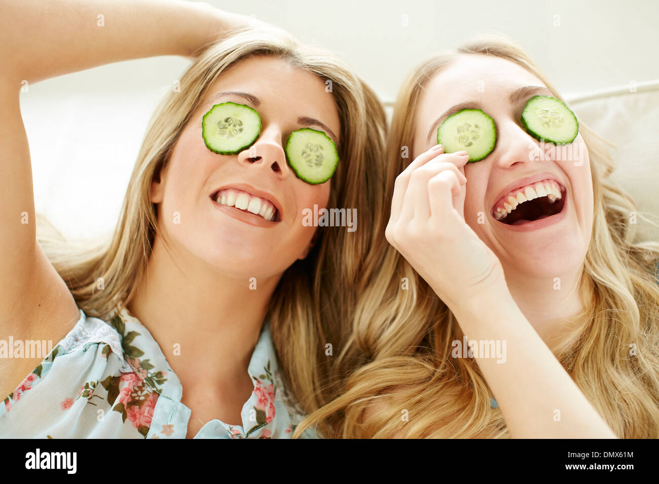 Women with cucumber over their eyes Stock Photo Alamy