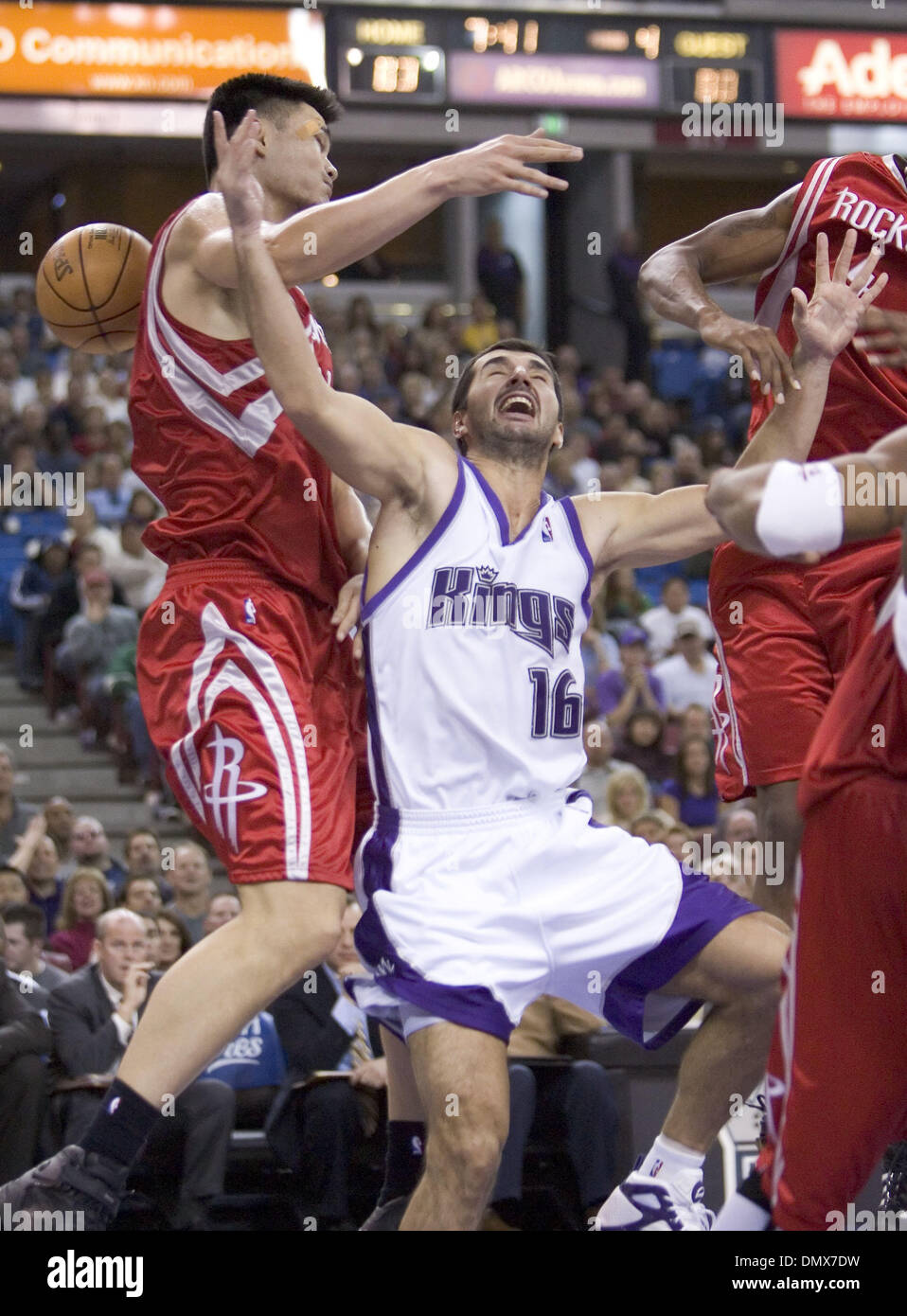 Dec 08, 2005; Sacramento, CA, USA; Sacramento Kings Peja Stojakovic loses control of ball as he drives to the basket in the 4th period against Houston Rockets Yao Ming in their 106-95 loss at Arco Arena in Sacramento, California on December 8, 2005. Mandatory Credit: Photo by Paul Kitagaki Jr./Sacramento Bee /ZUMA Press. (©) Copyright 2005 by Sacramento Bee Stock Photo