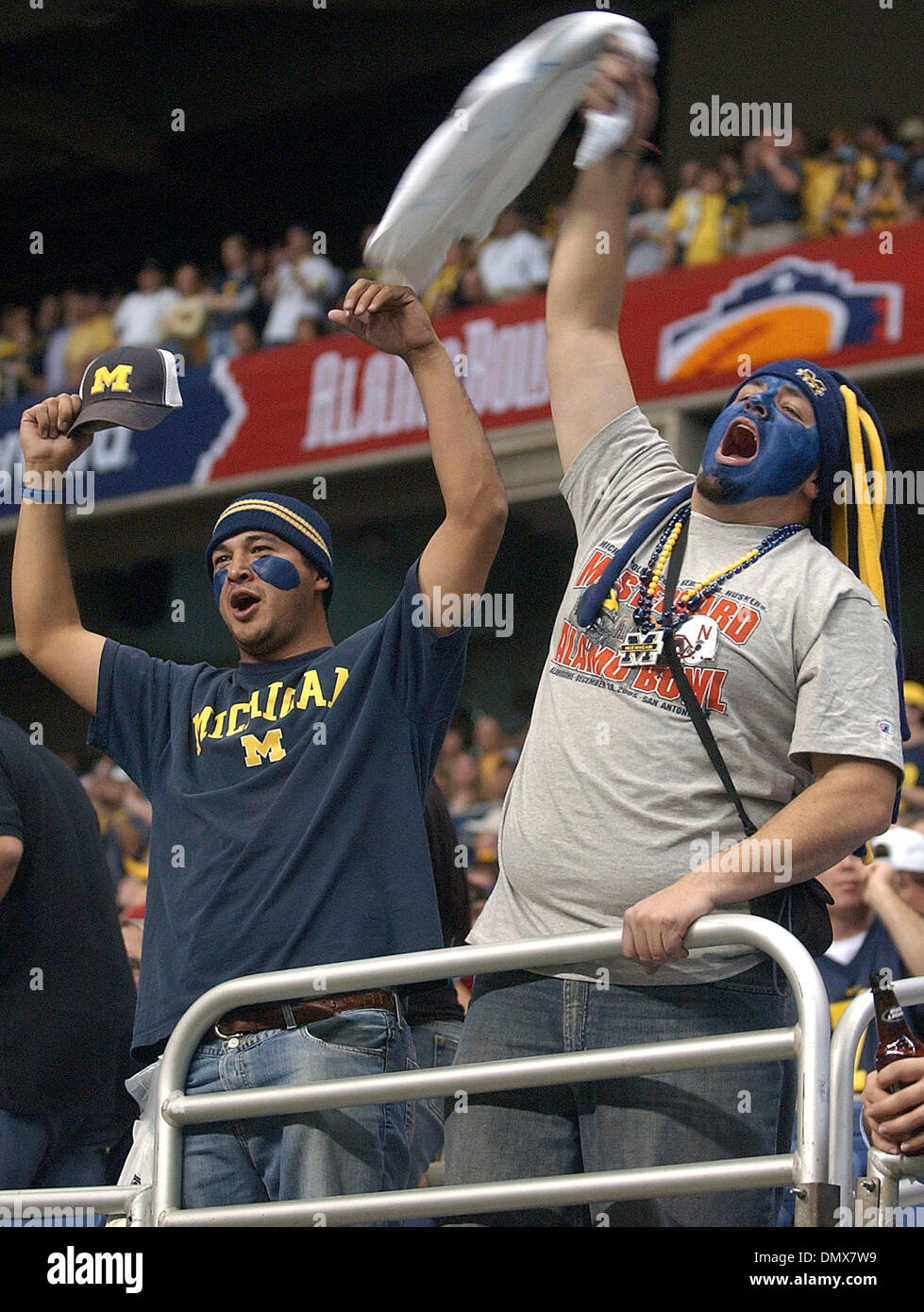 Dec 28, 2005; San Antonio, TX, USA; NCAA FOOTBALL: Sergio Contreras (left) and Jeremy Herrera cheer their Michigan Wolverines as they take the field for the first half during the Nebraska Cornhuskers victory over the Michigan Wolverines in the 2005 Alamo Bowl at the Alamodome in San Antonio, Texas. Mandatory Credit: Photo by T Reel/San Antonio Express-News/ZUMA Press. (©) Copyright Stock Photo