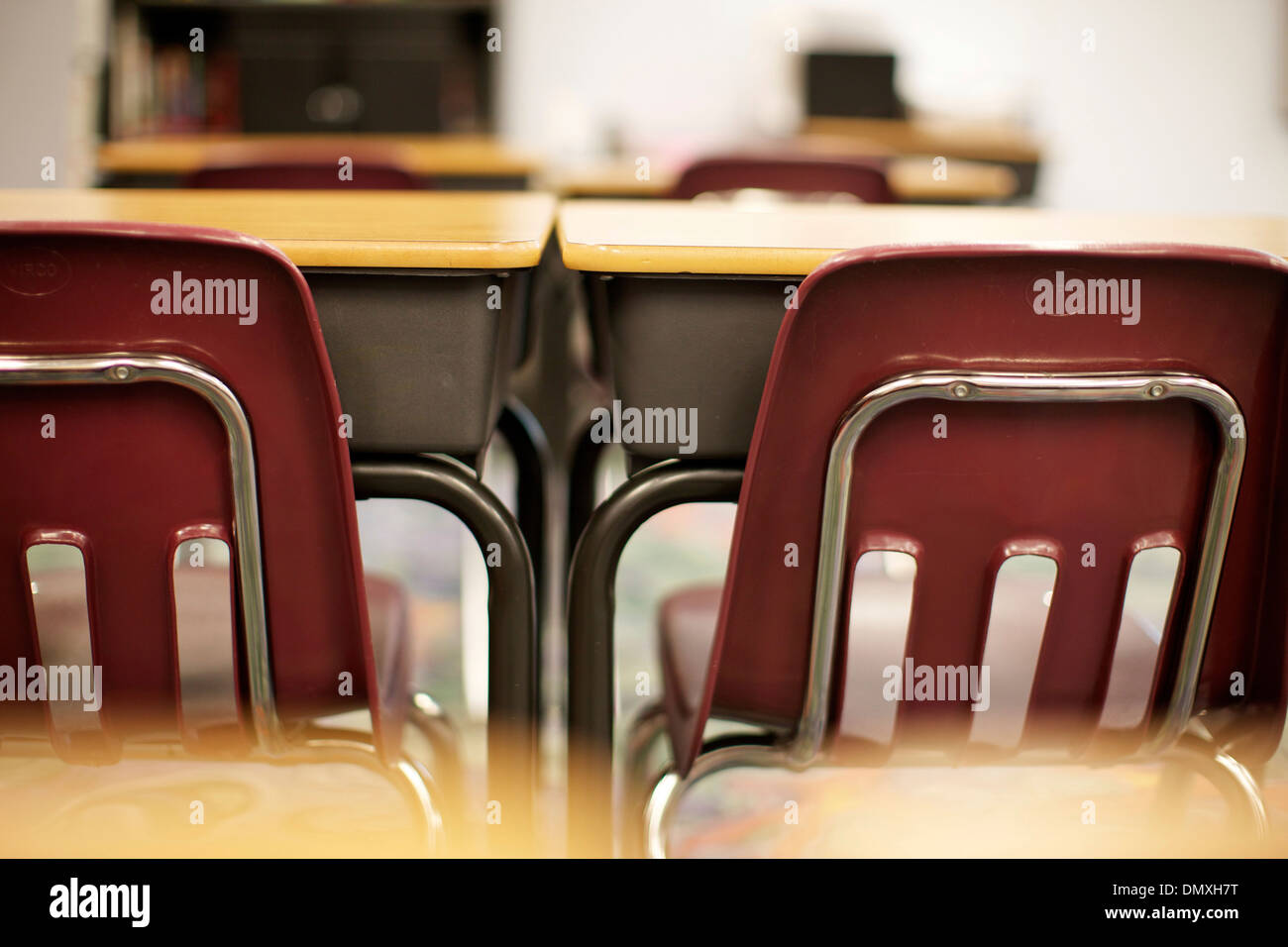 An Empty Row Of Desks In An Inner City Middle School Stock Photo