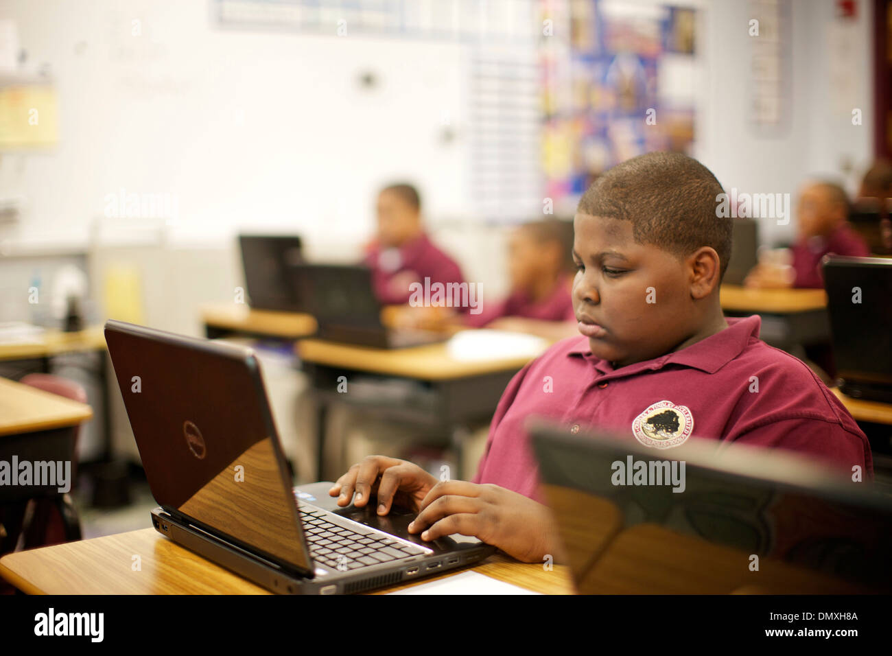 Middle school aged African American boy paying attention in class Stock ...