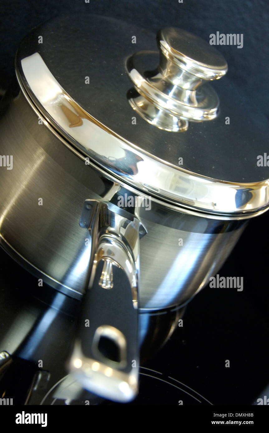 Stainless steel saucepan on electric hob Stock Photo Alamy