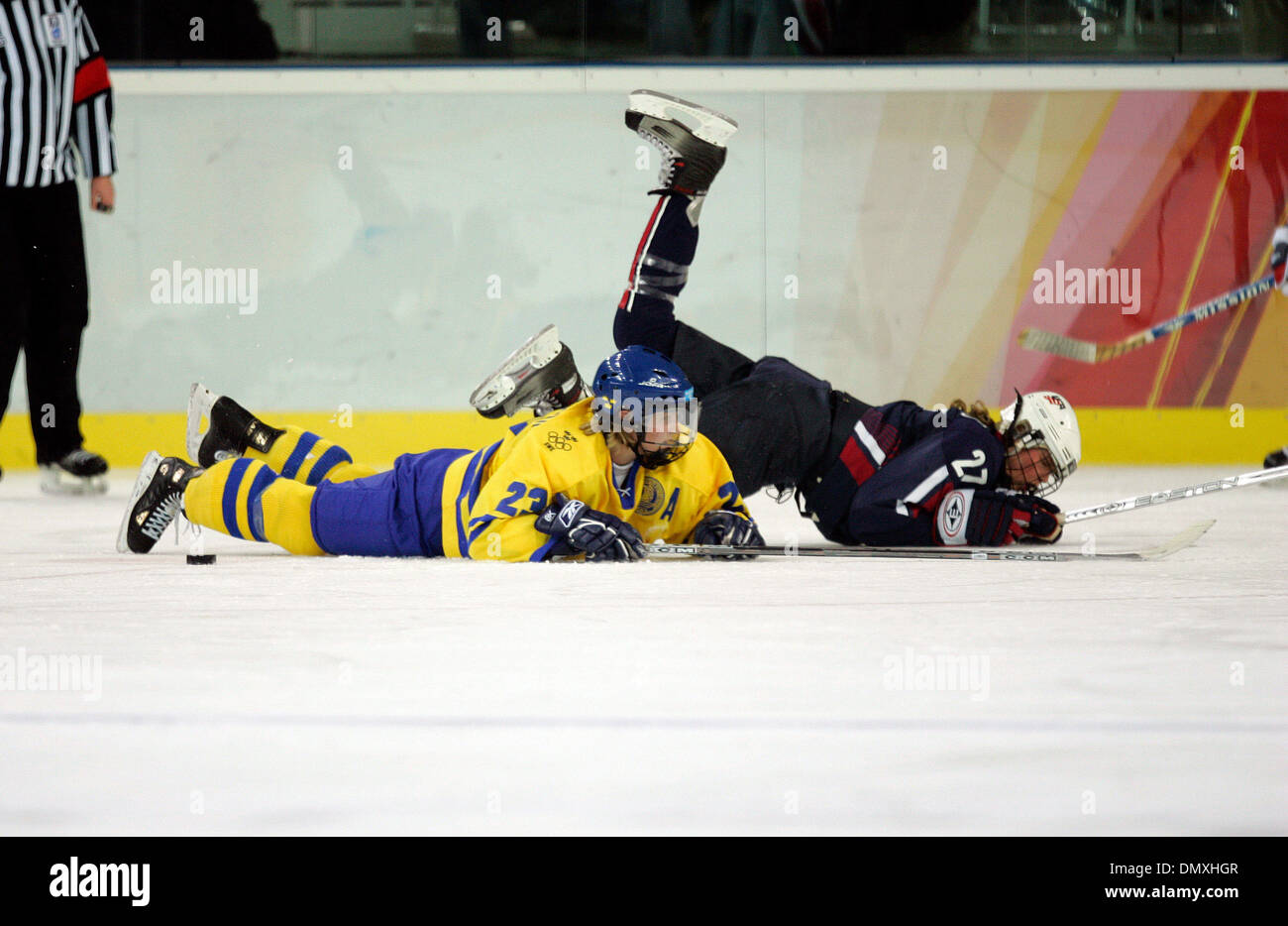 Feb 17, 2006; Turin, ITALY; Sweden beat the United States in a shootout overtime in the women's semifinal game in Turin at the XX Winter Olympic Games  on Tuesday, Feb. 17, 2006.  Here, SARAH PARSONS of the United States gets tripped up by Sweden's GUNILLA ANDERSON. Mandatory Credit: Photo by K.C. Alfred/SDU-T /ZUMA Press. (©) Copyright 2006 by SDU-T Stock Photo