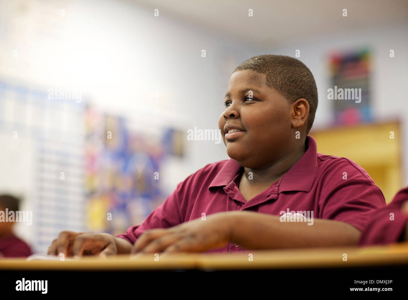 Middle school aged African American boy paying attention in class Stock ...