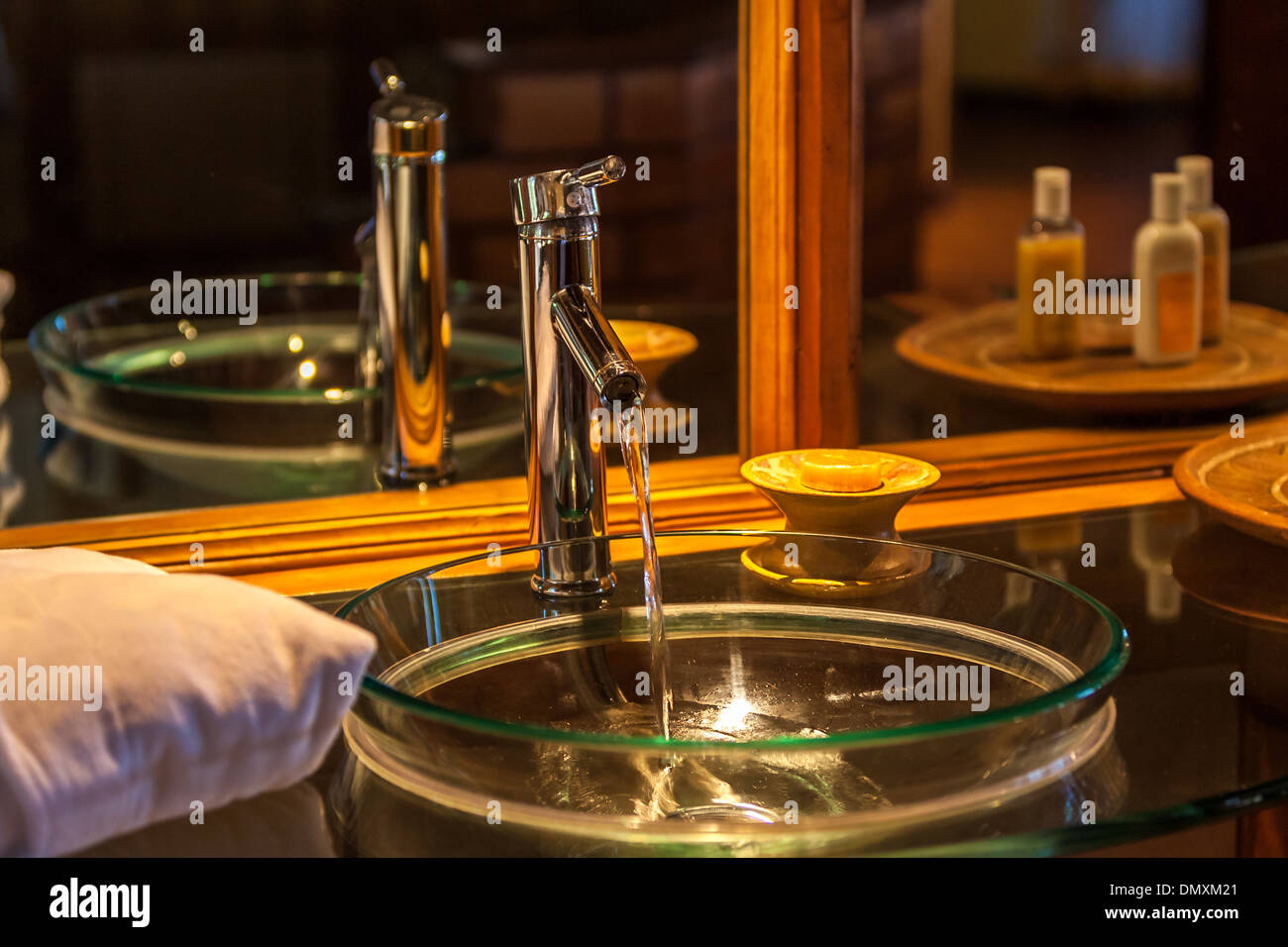 Tap flowing in a luxurious hotel room bathroom Stock Photo - Alamy
