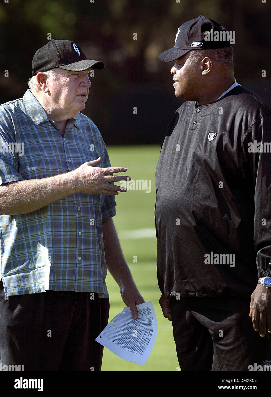 MONDAY JULY 24, 2006 NAPA, CA. - Raiders Head Coach Art Shell speaks with  John Madden during the first day of Oakland Raiders training camp at  Redwood Middle School in Napa on