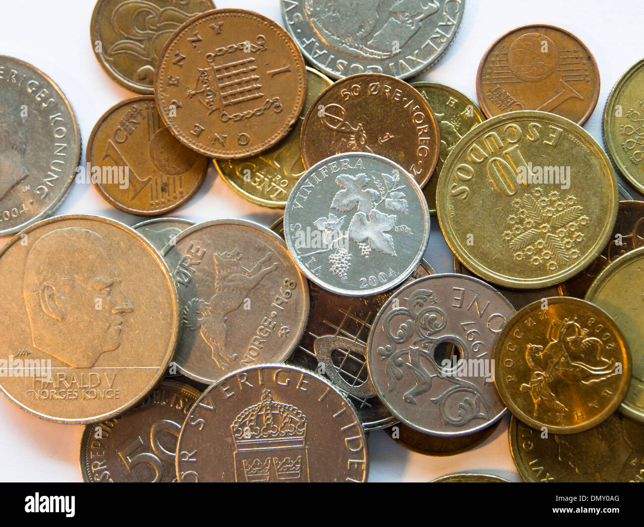 Coins on white background different countries currency, Norwegian krone øre,  UK, Portuguese escudos old, Swedish krona Stock Photo - Alamy