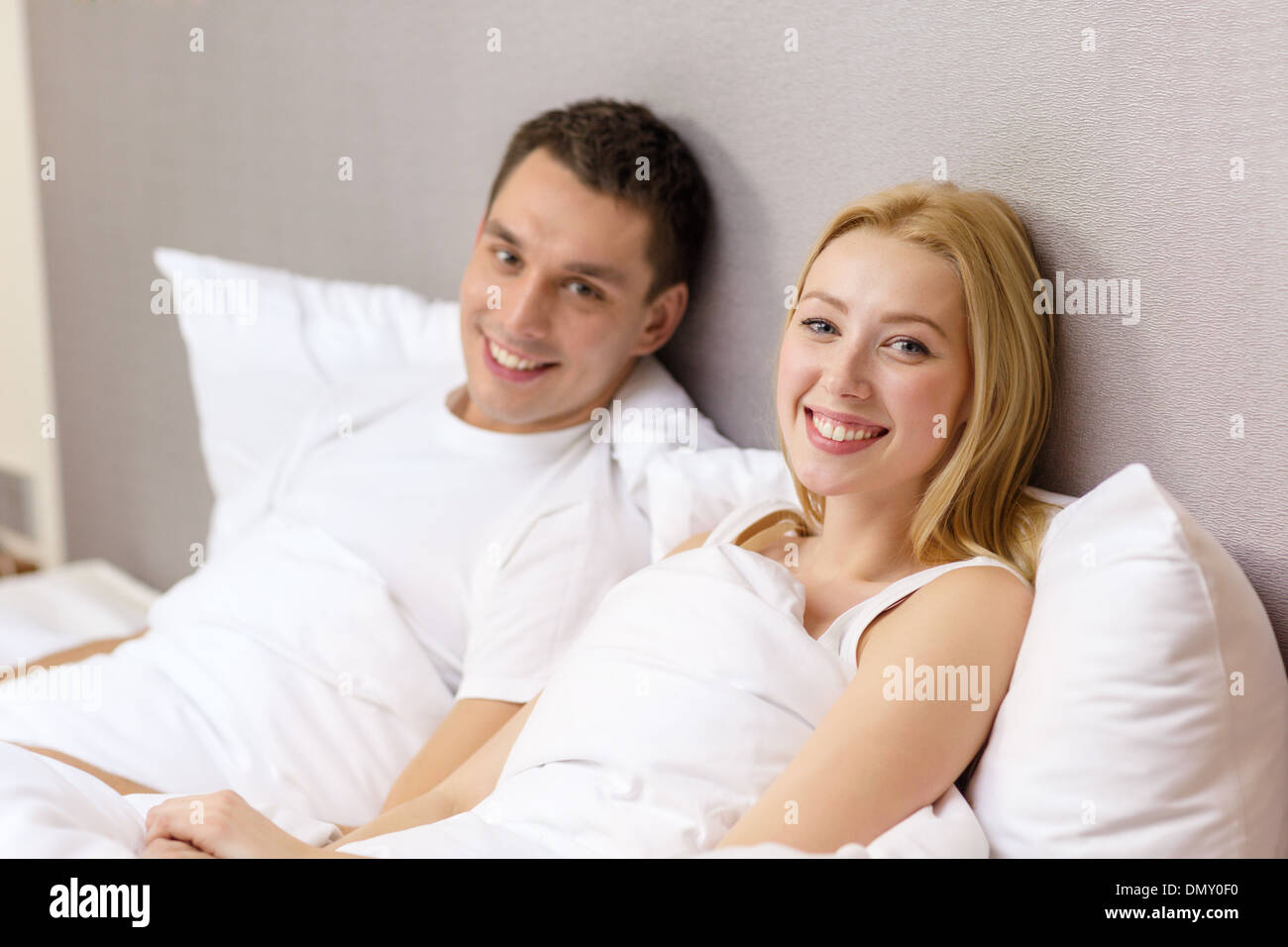 happy couple sleeping in bed Stock Photo - Alamy