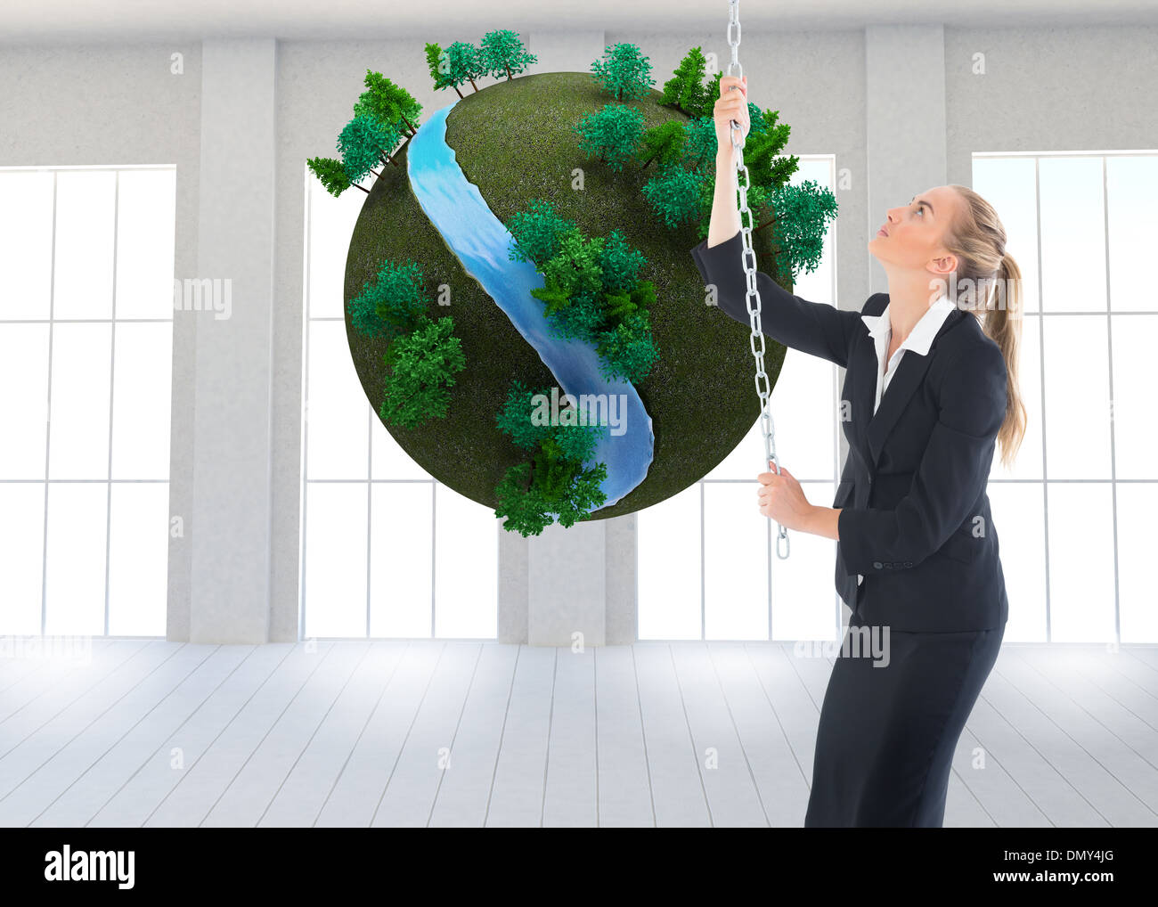 Composite image of businesswoman pulling a chain Stock Photo - Alamy
