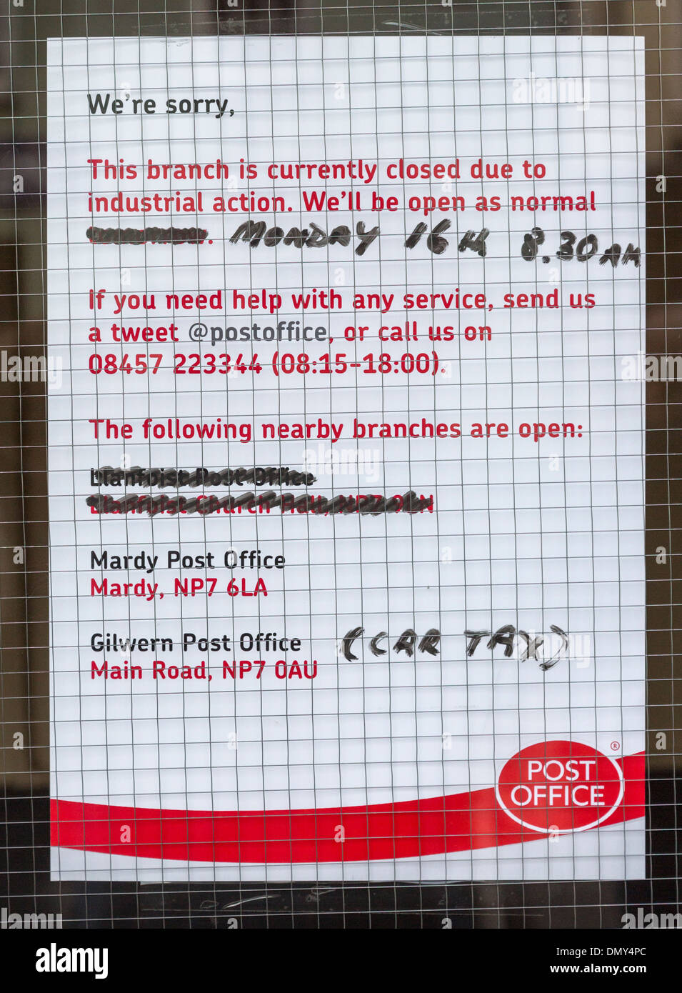 Closed due to industrial action sign in window of Crown Post Office, Abergavenny, UK Stock Photo