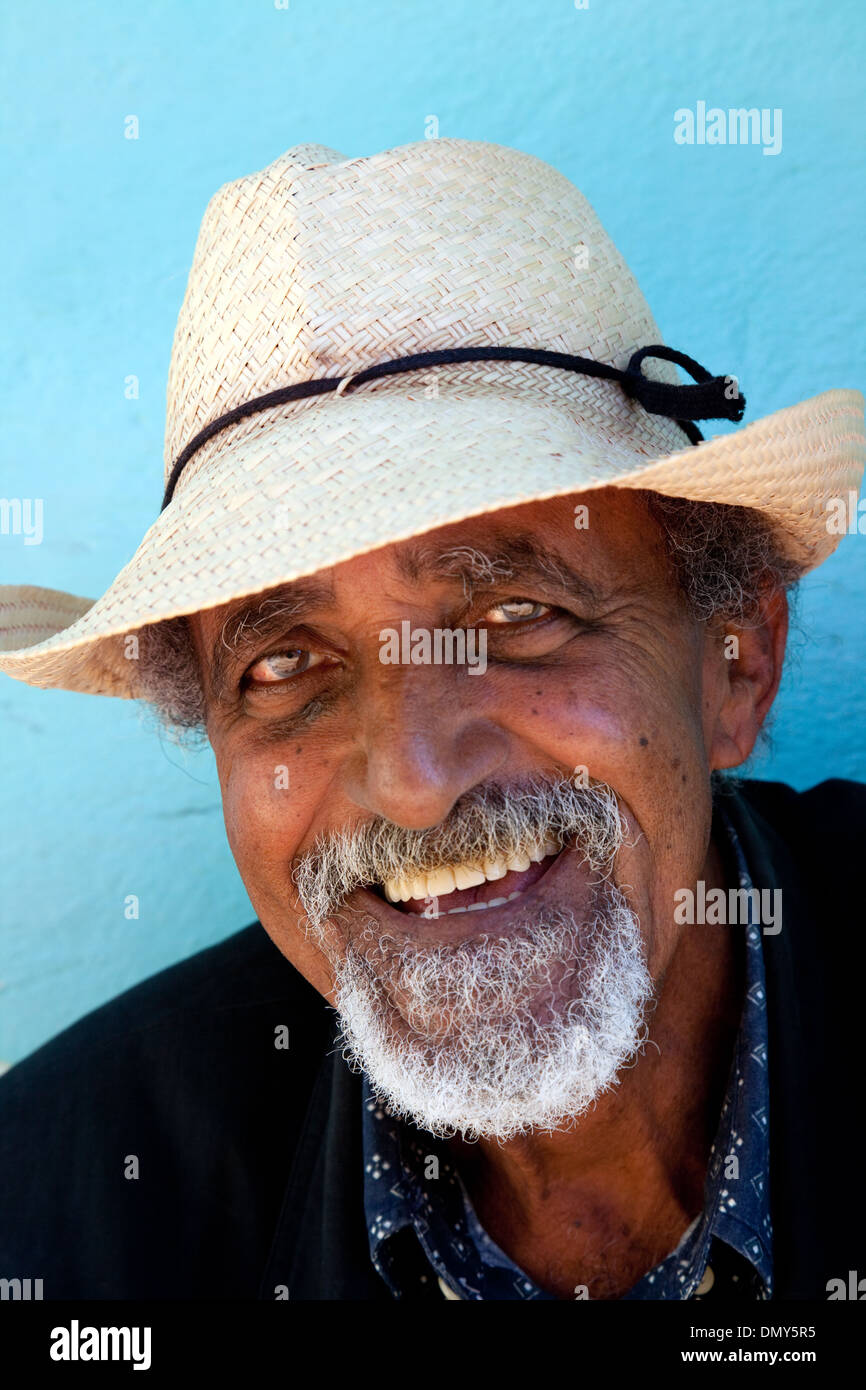 Cuban man aged 60 years smiling, head and shoulders portrait, face; Trinidad Cuba Caribbean Latin america Stock Photo