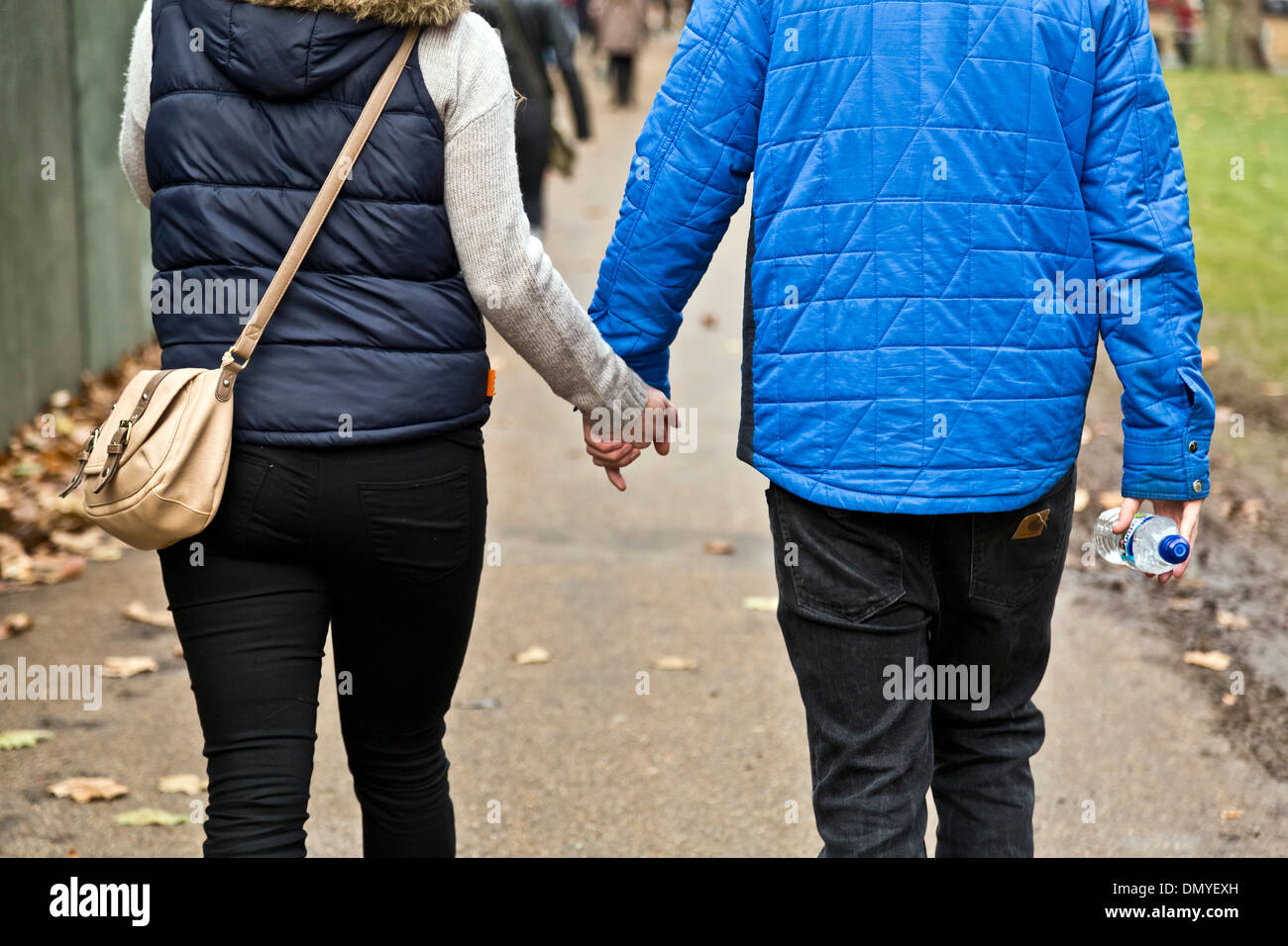 Boy and girl holding hands hi-res stock photography and images - Alamy