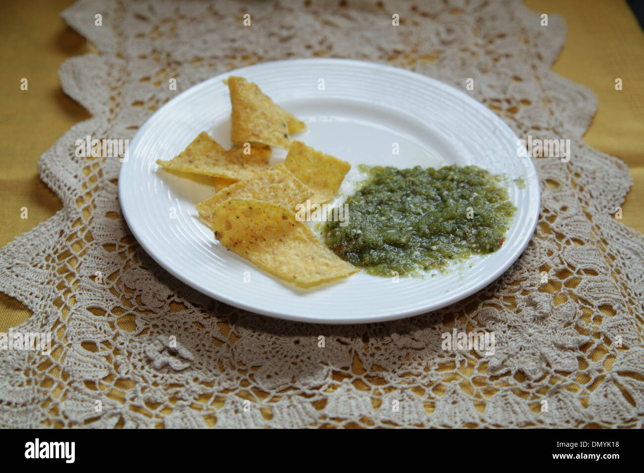 Tortilla chips and Salsa Verde Stock Photo