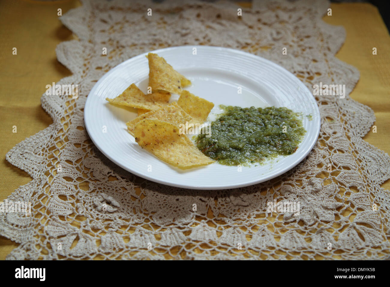 Tortilla chips and Salsa Verde Stock Photo