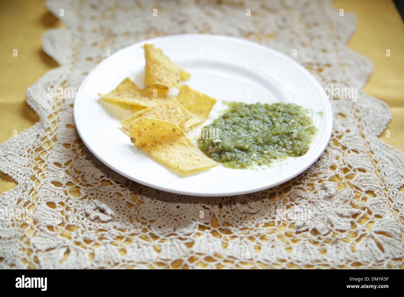 Tortilla chips and Salsa Verde Stock Photo