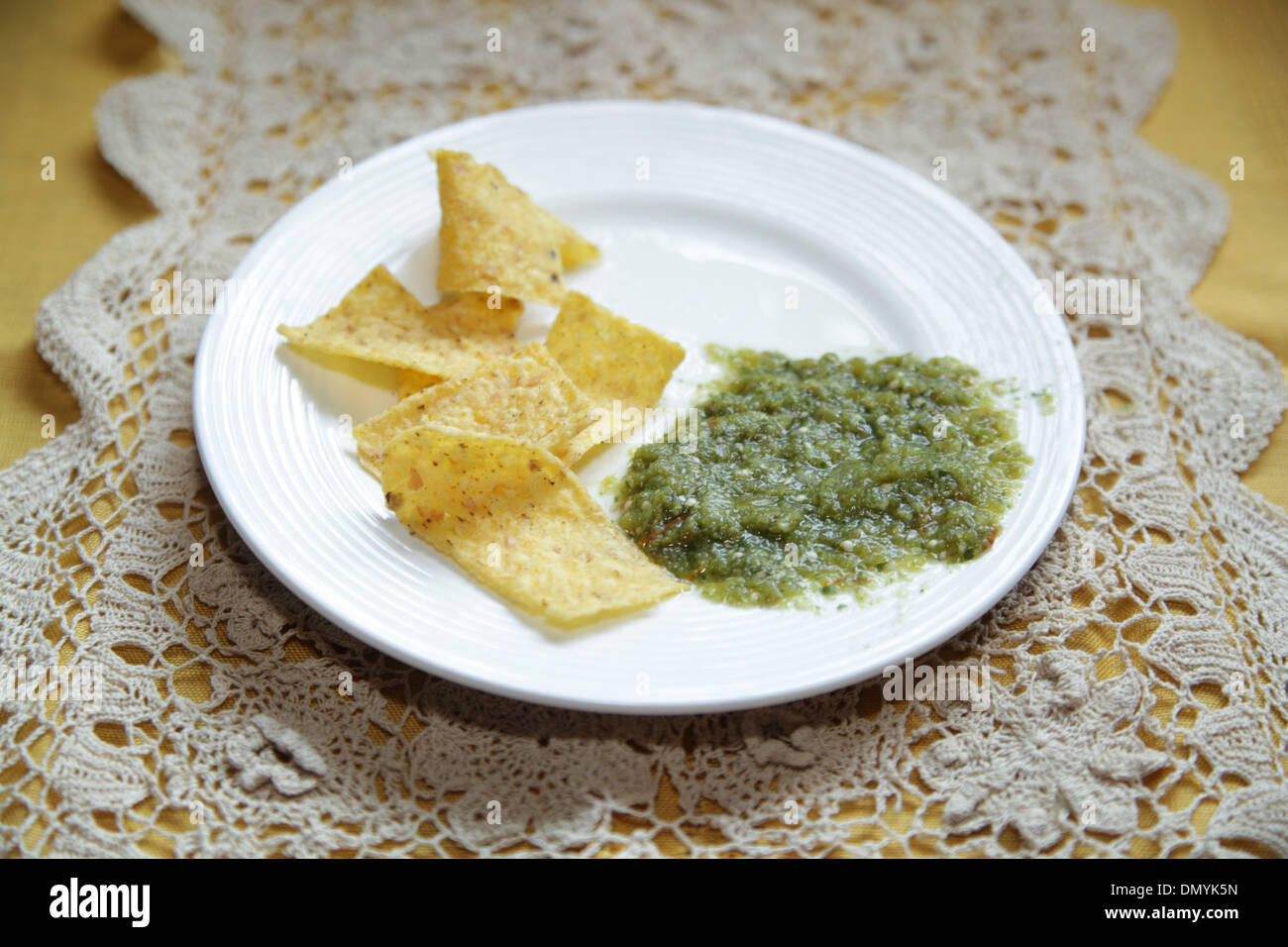 Tortilla chips and Salsa Verde Stock Photo Alamy