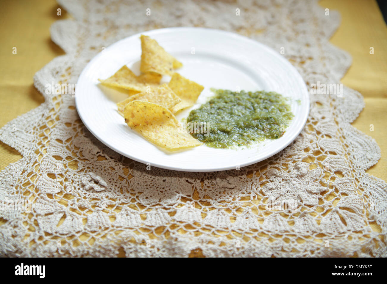 Tortilla chips and Salsa Verde Stock Photo