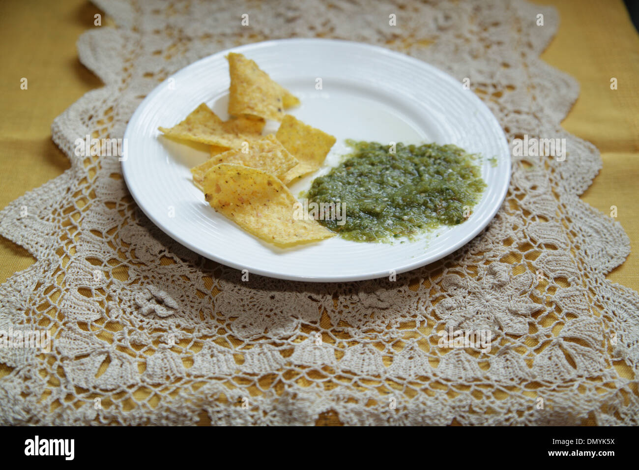 Tortilla chips and Salsa Verde Stock Photo