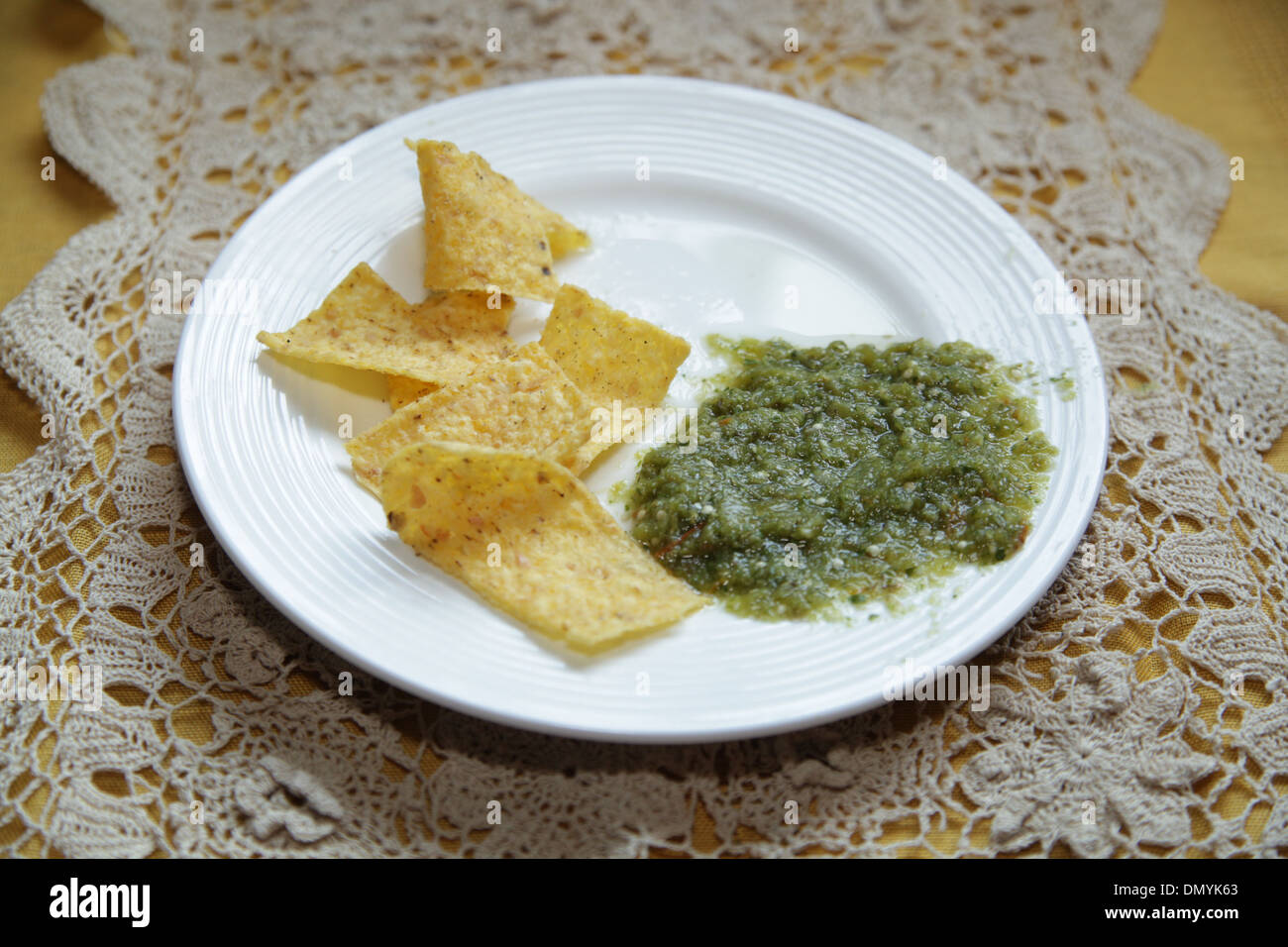 Tortilla chips and Salsa Verde Stock Photo