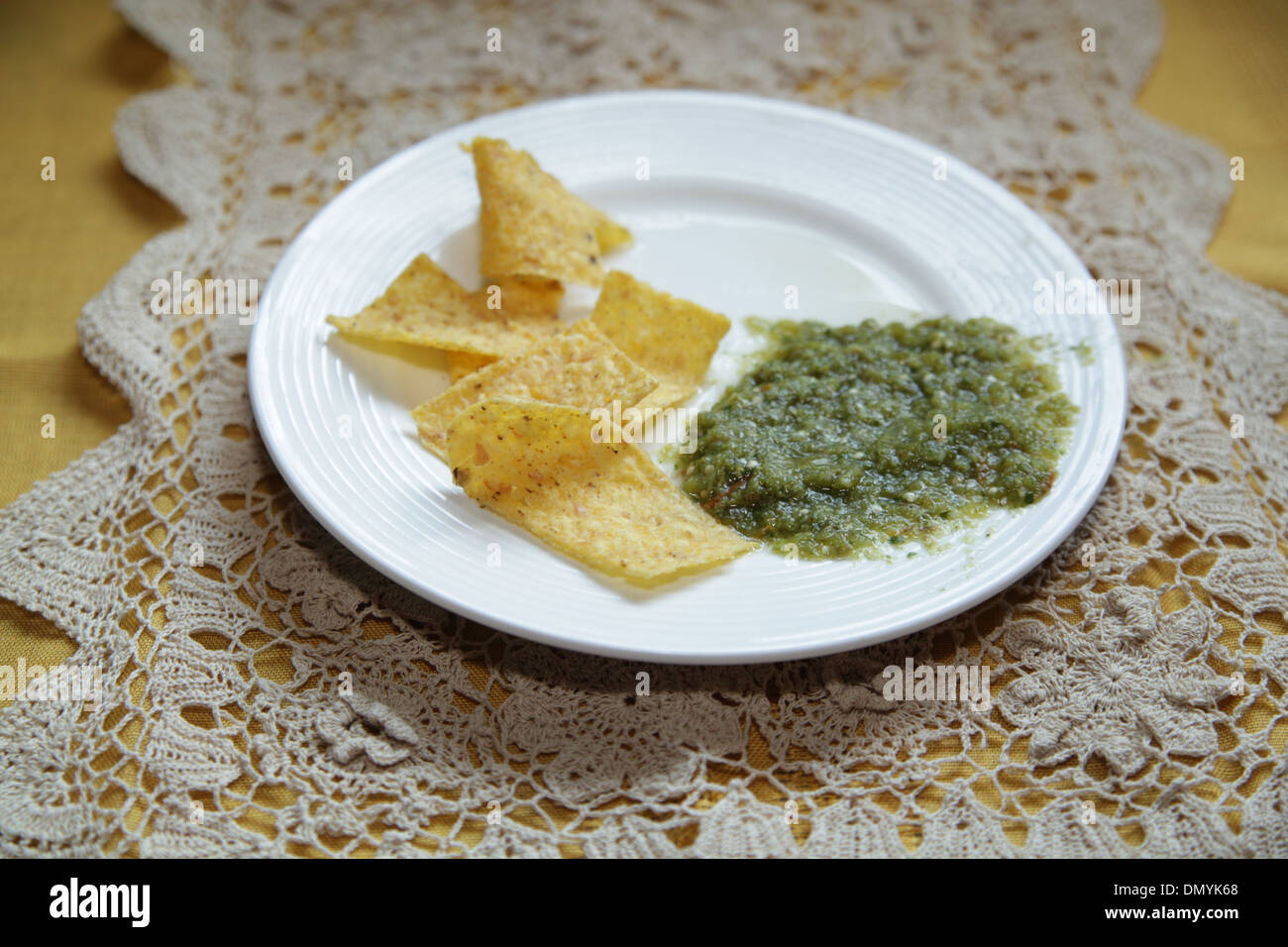 Tortilla chips and Salsa Verde Stock Photo