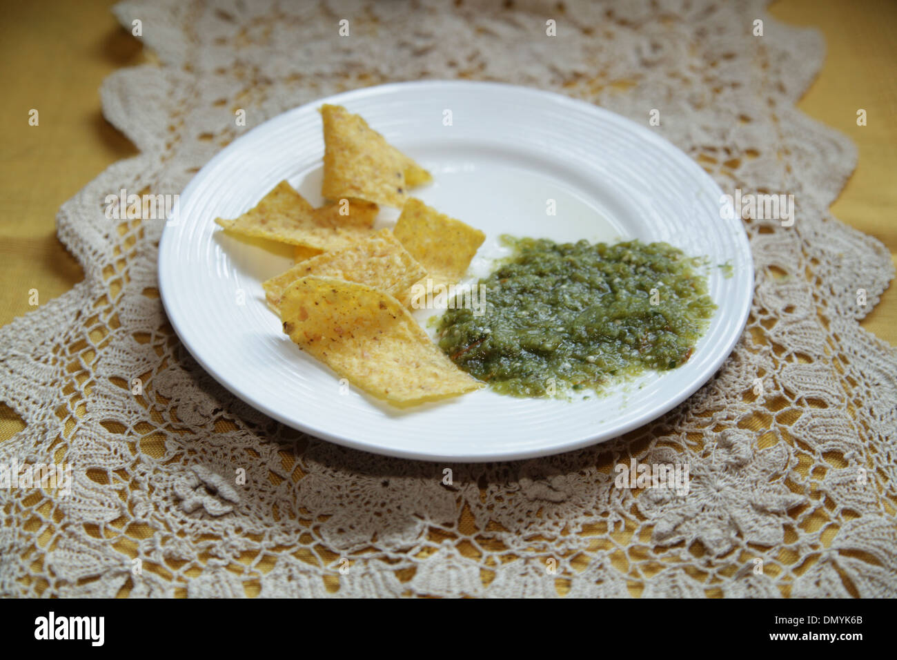 Tortilla chips and Salsa Verde Stock Photo